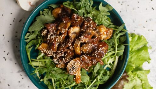 Sliced mushroom in bowl with lettuce