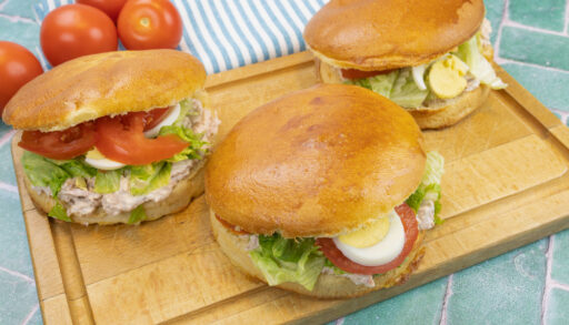 Three tuna bagnat bread on a cutting board