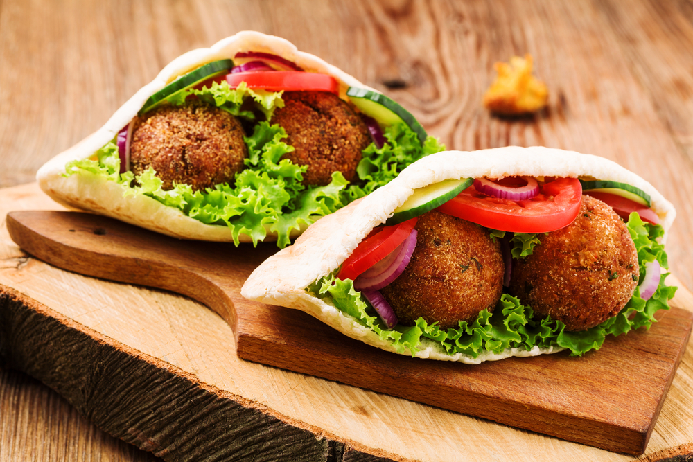 Falafel in pita on cutting board