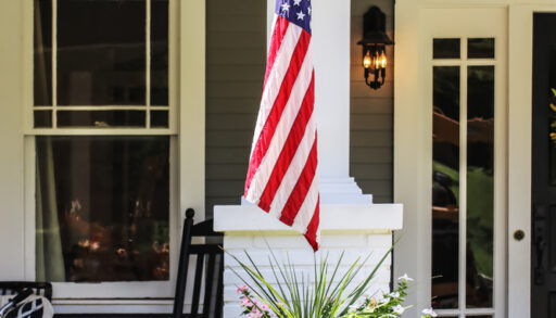 American flag hanging off cottage
