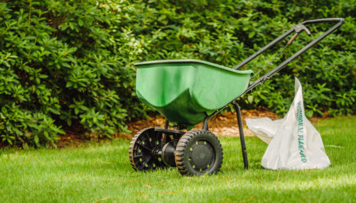 manual walker grass fertilizer on lawn