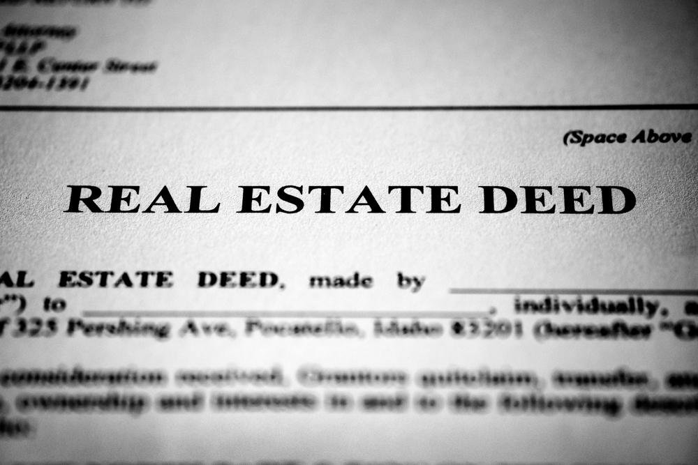 Close-up of a real estate deed document.