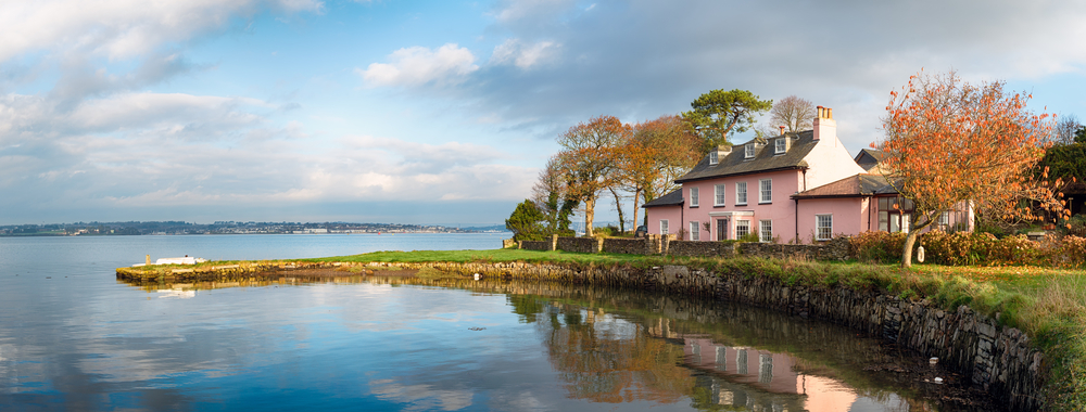 Pink cottage and shoreline