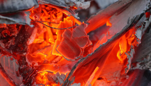 Close-up of burning paper waste.