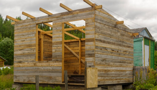 Rustic wooden shed under construction.