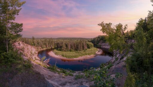 Big bend at Arrowhead Provincial Park during a magenta-coloured sunset.