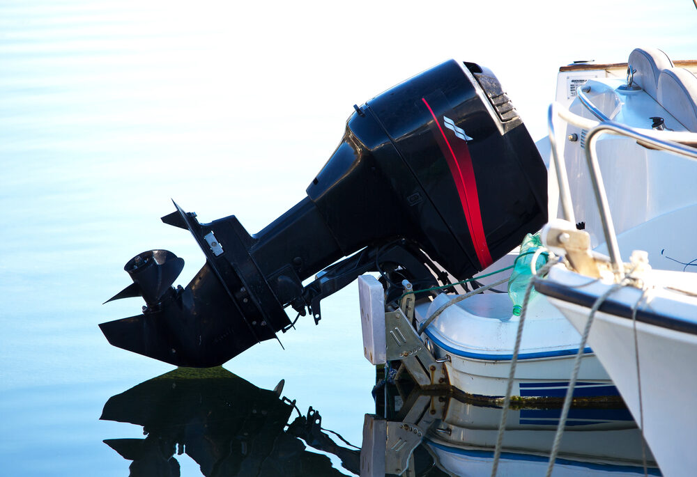 Close-up of a black outboard boat engine.