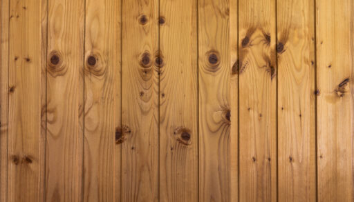 Close-up of pine flooring running vertically.