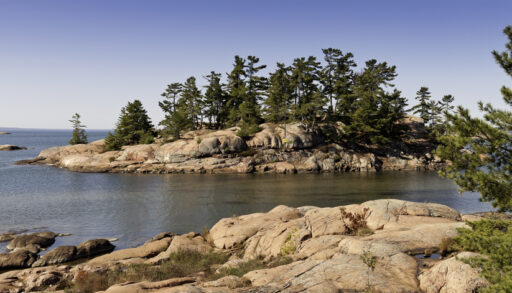 View of rock formations with trees in Georgian Bay, Ontario.