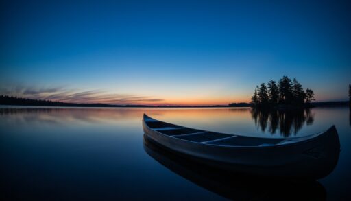 Sunset on Gull Lake, Ontario with a canoe.