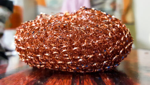 Close-up of a copper pot scrubber.
