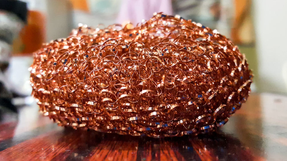 Close-up of a copper pot scrubber.
