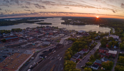 Aerial view of Kenora, Ontario next to a lake at sunset.