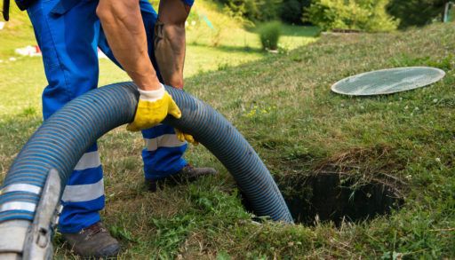 Emptying household septic tank. Cleaning sludge from septic system.