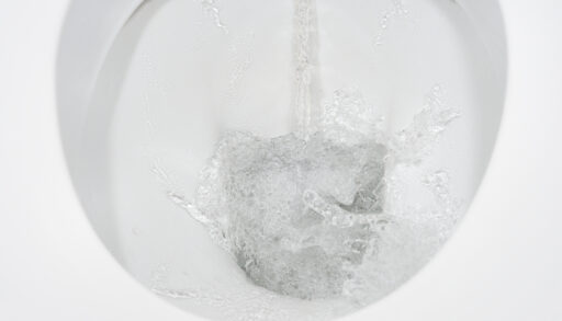 Close-up of a toilet being flushed.