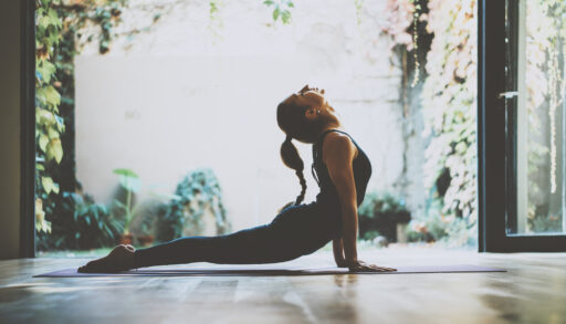 Young woman doing a yoga pose.