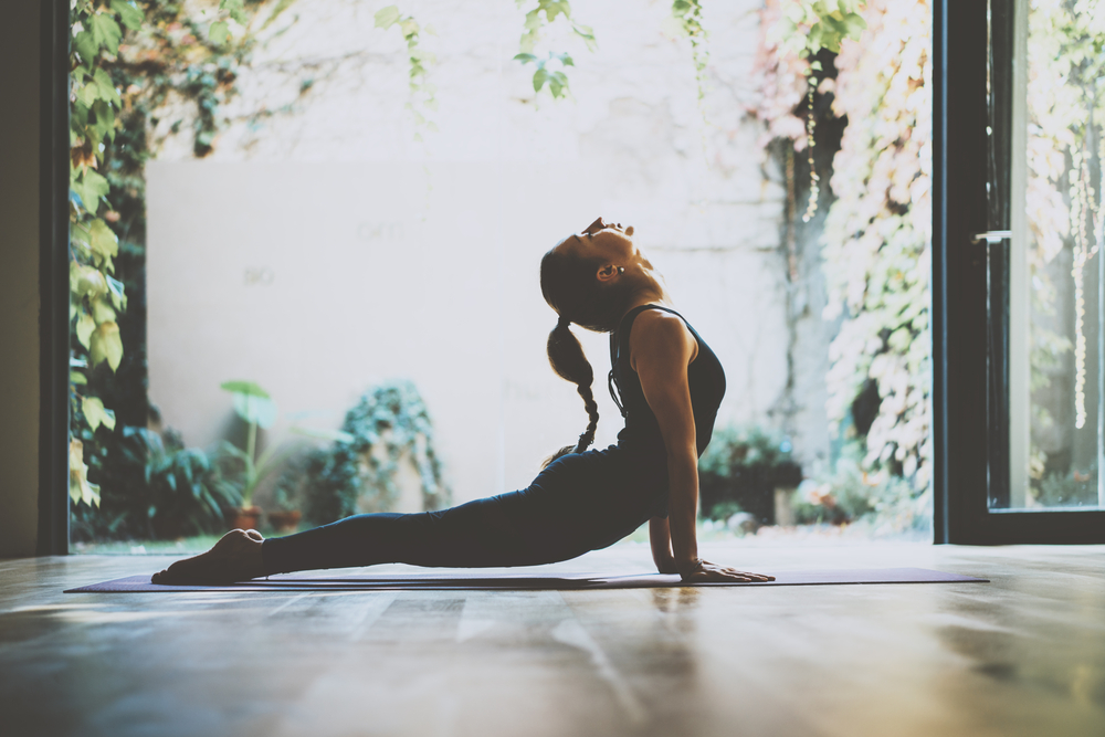 Young woman doing a yoga pose.
