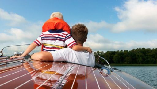 Father and son on speedboat