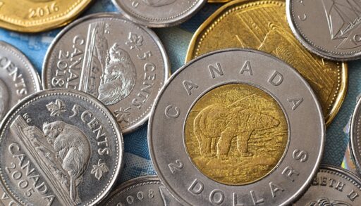 Close-up of Canadian two-dollar and five-cent coins.