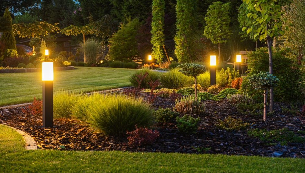 Exterior lights at night in a garden.