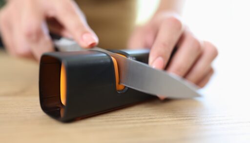 Person sharpening a knife.