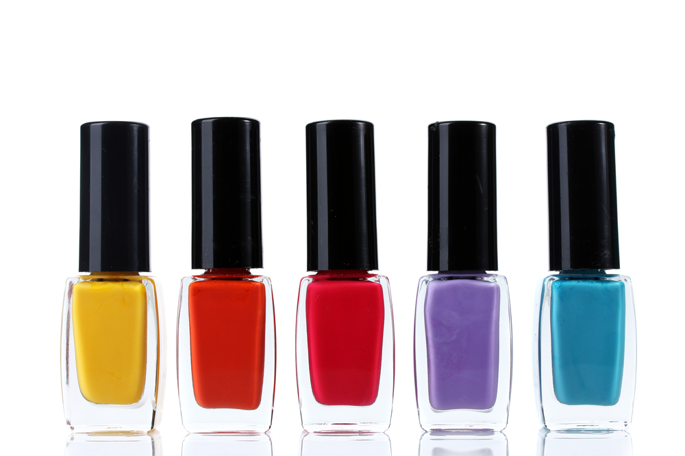 Different coloured bottles of nail polish.