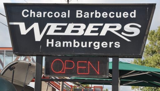 Black sign for Webers Restaurant in Orilla, Ontario.