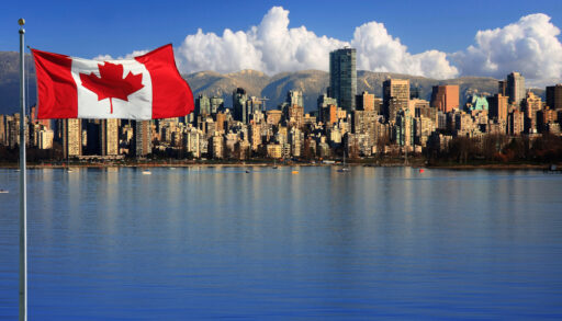 Canadian flag in front of Vancouver, British Columbia, Canada.