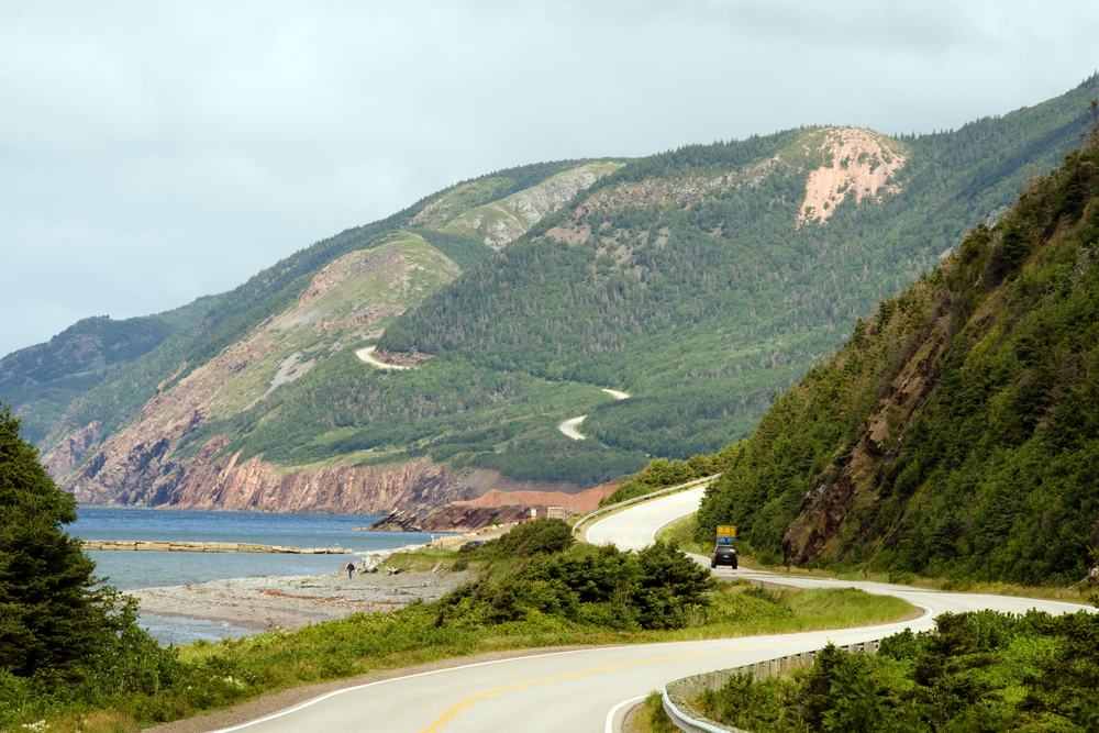Winding road along the hills of Cape Breton Highlands National Park in Nova Scotia.