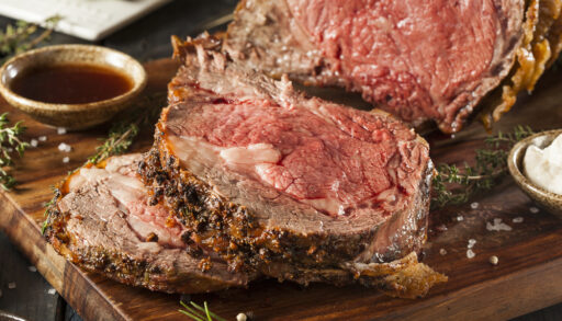 Close-up of a sliced, cooked prime rib roast.