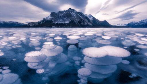 Ice bubbles on a frozen Abraham Lake, Alberta, Canada.