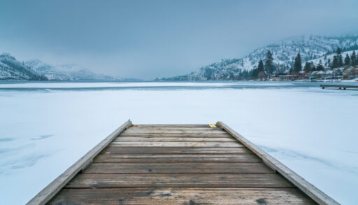 dock in frozen lake in winter