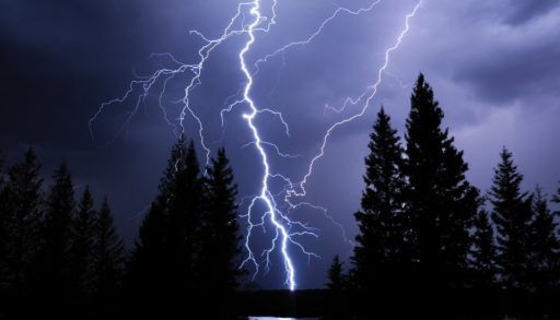 Lightning strike illuminates the night sky over Morin Lake, Saskatchewan.