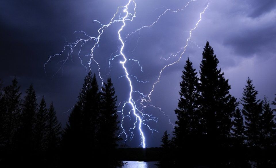 Lightning strike illuminates the night sky over Morin Lake, Saskatchewan.