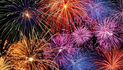 Colourful fireworks lighting up a dark sky.