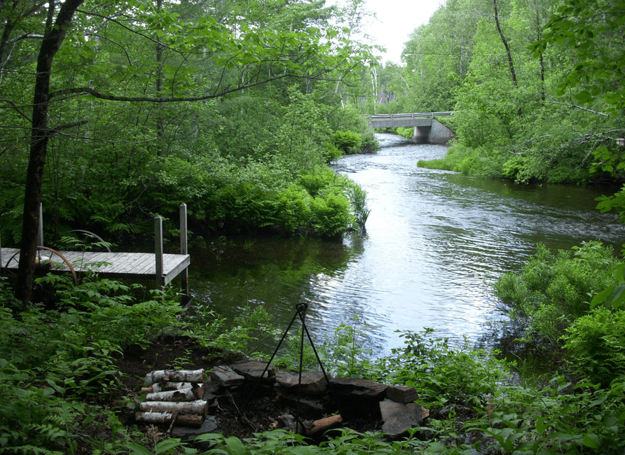 Stream and deck in front of the cabin