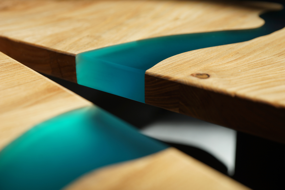 Close-up of wood combined with blue resin.