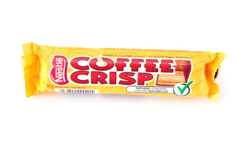 Coffee Crisp chocolate bar on white background. Coffee Crisp is a chocolate bar produced locally in in Canada and it is mostly unavailable in other countries