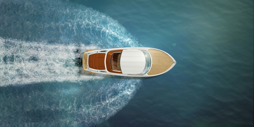 Overhead view of a speed boat travelling across the water.