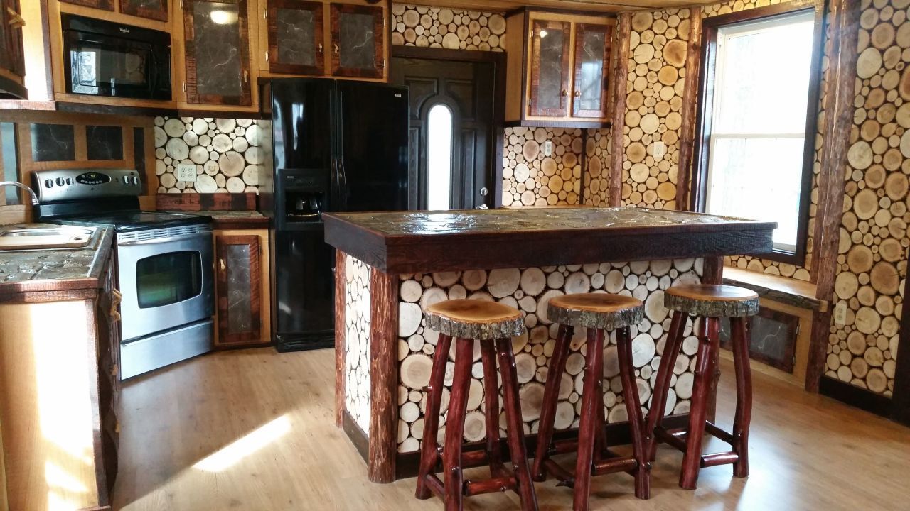The handmade kitchen covered in wood slices.