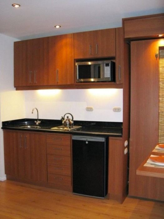 The kitchen inside the shipping container tiny house.