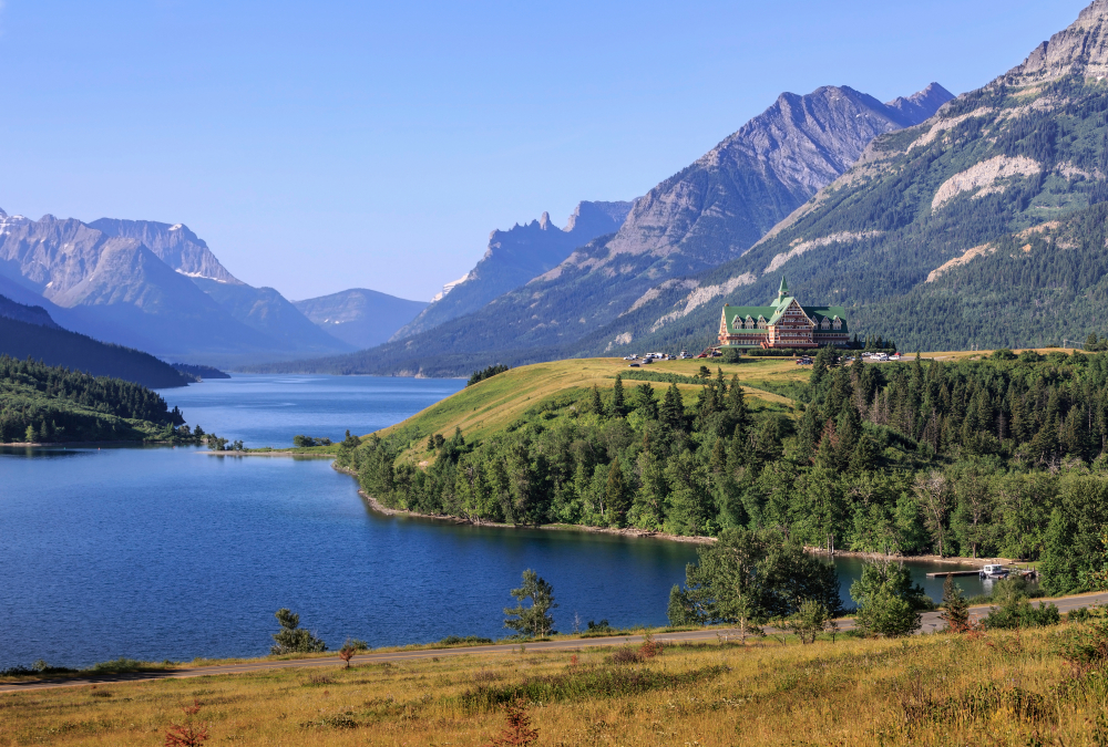 The Prince of Wales Hotel surrounded by mountains in Waterton Lakes National Park, Alberta.