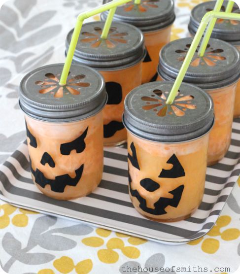 Jars decorated as jack-o-lanterns.