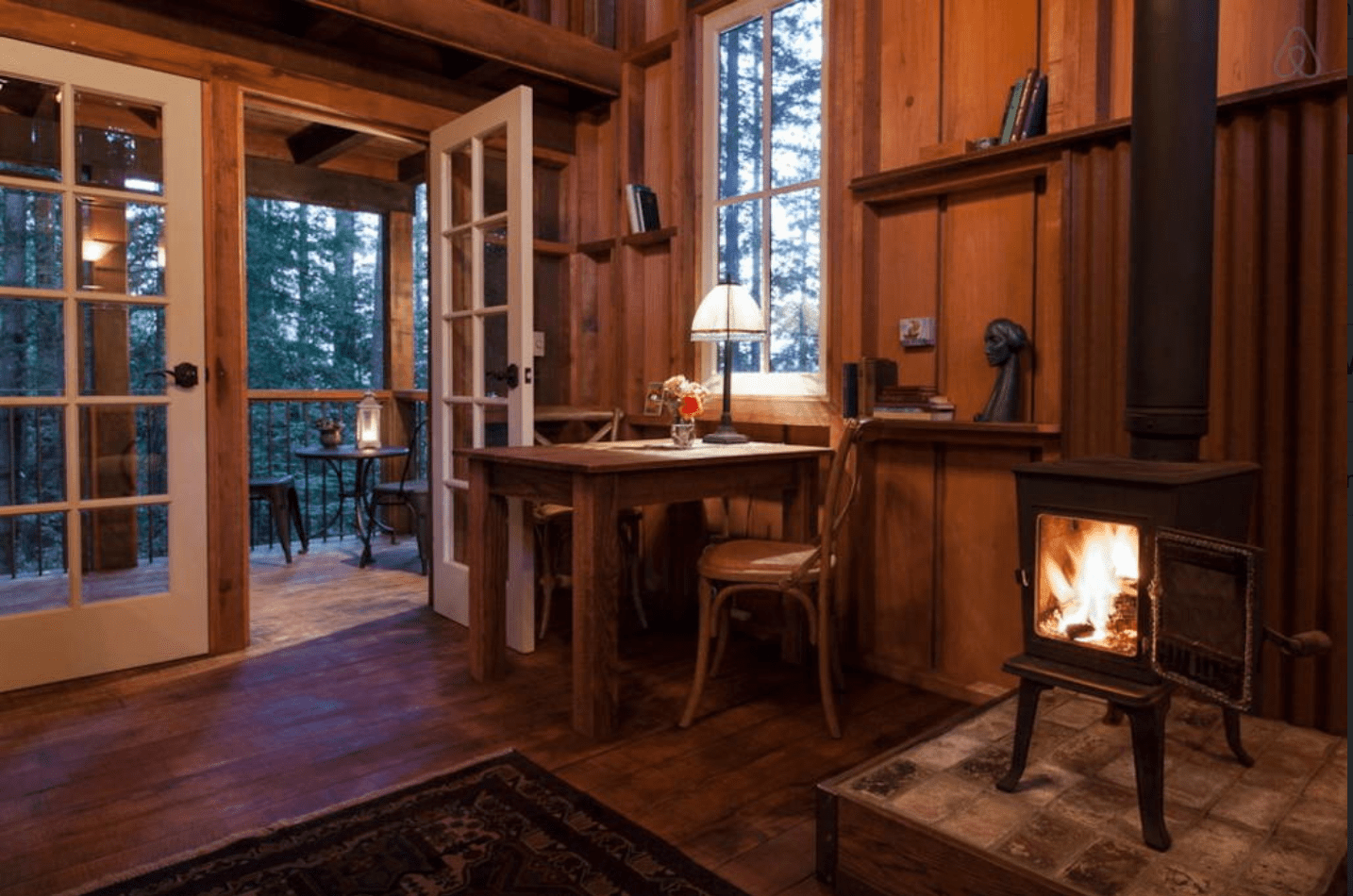 A view of Owl Tree cabin's dining room and back door.