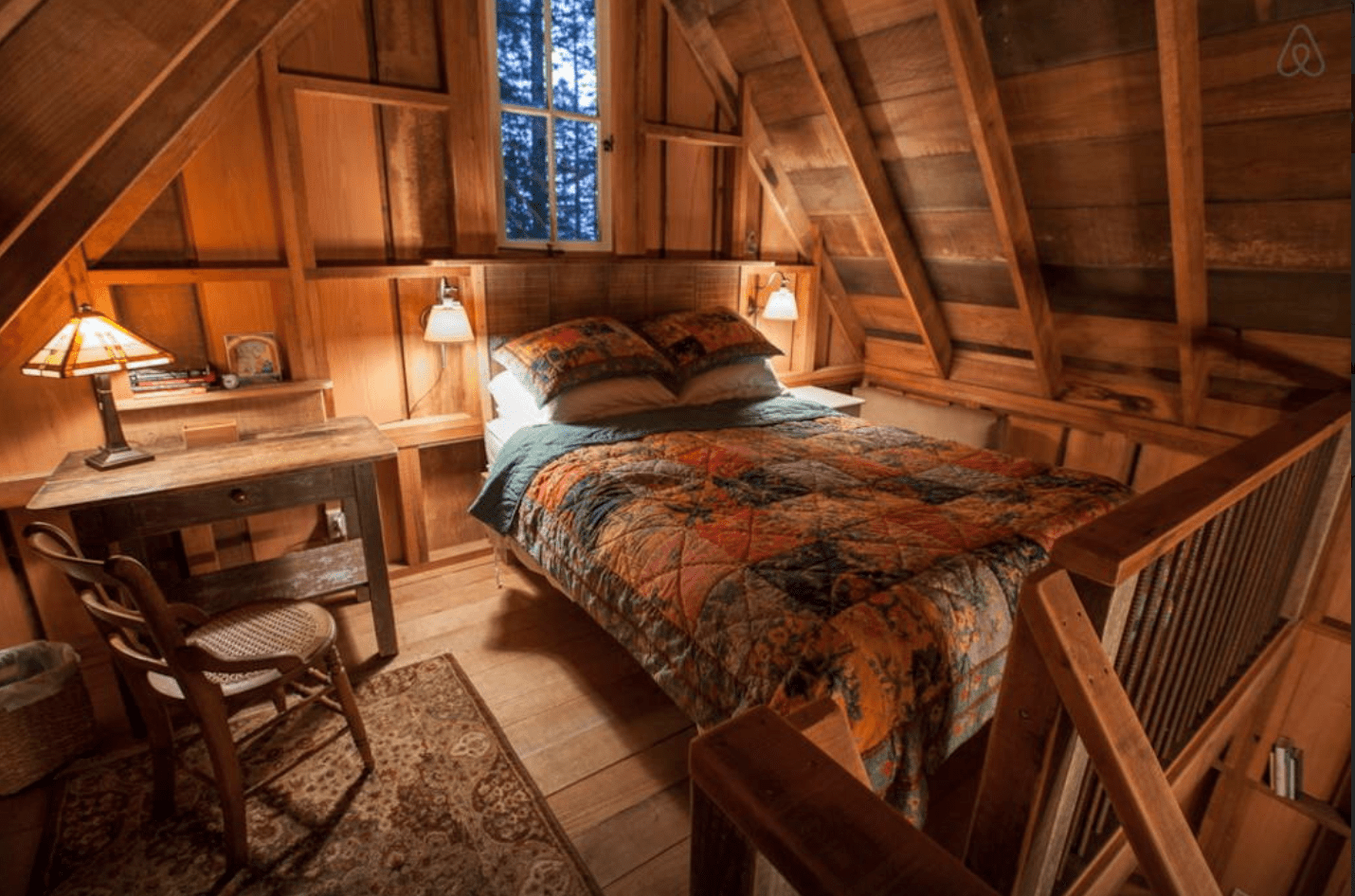 A view of Owl Tree cabin's loft bedroom.