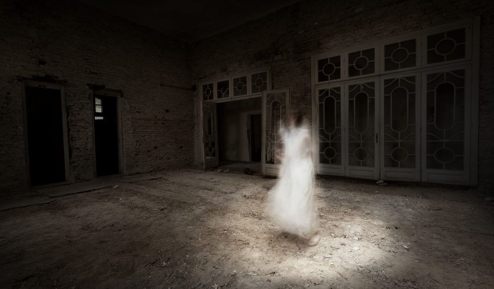 Ghost girl in a white dress in an old room.