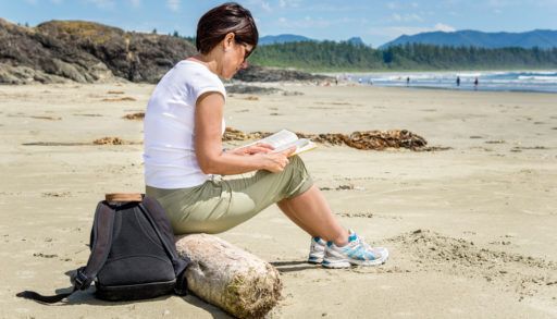 Woman reading on the beach.