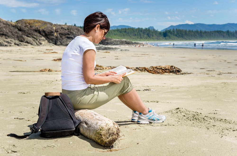Woman reading on the beach.