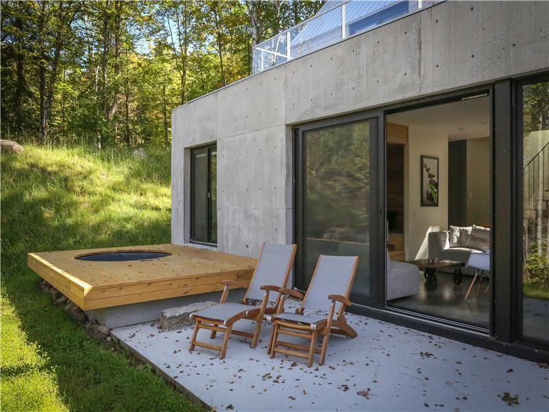 Outdoor area with chairs and hot tub