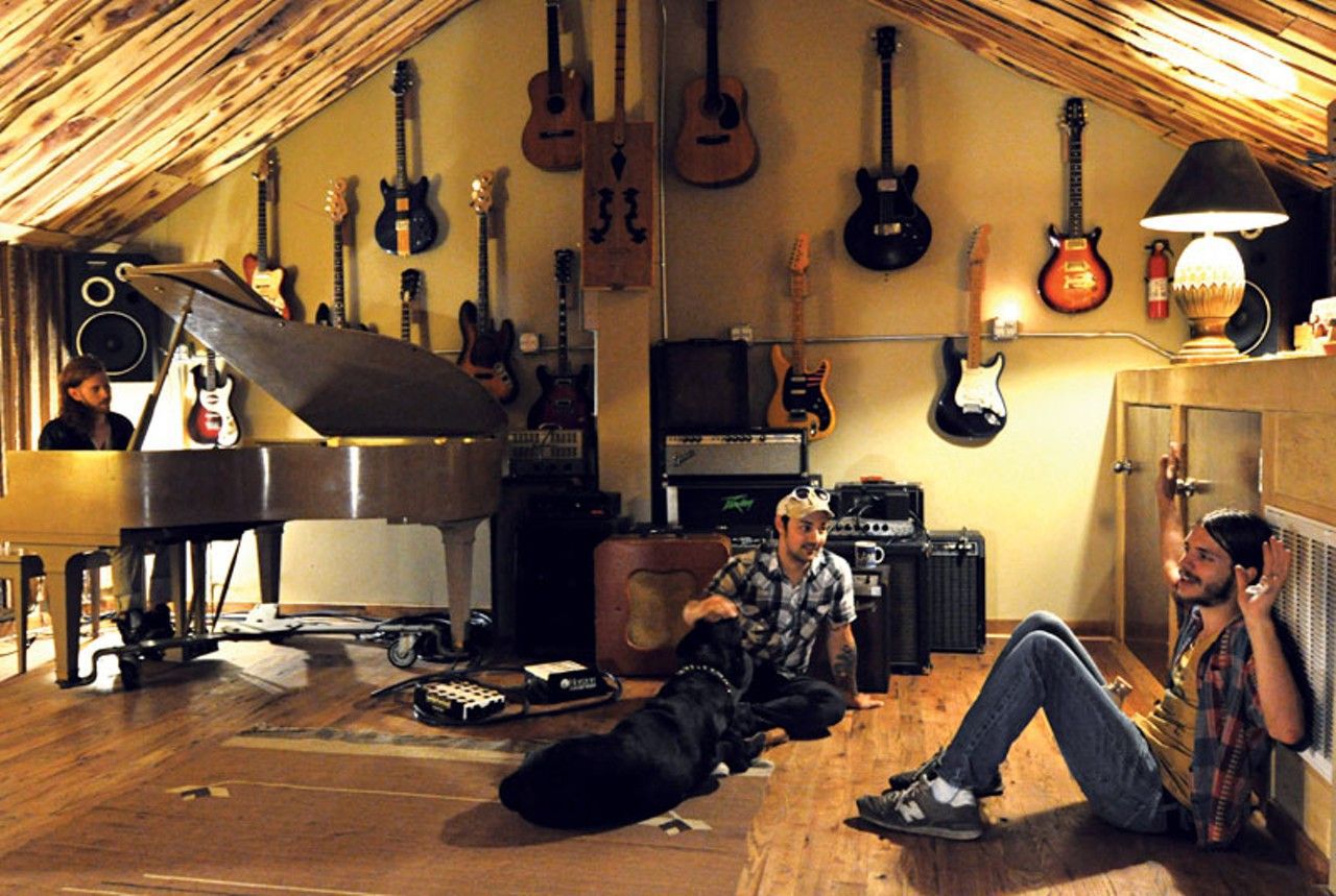 live room with guitars on walls